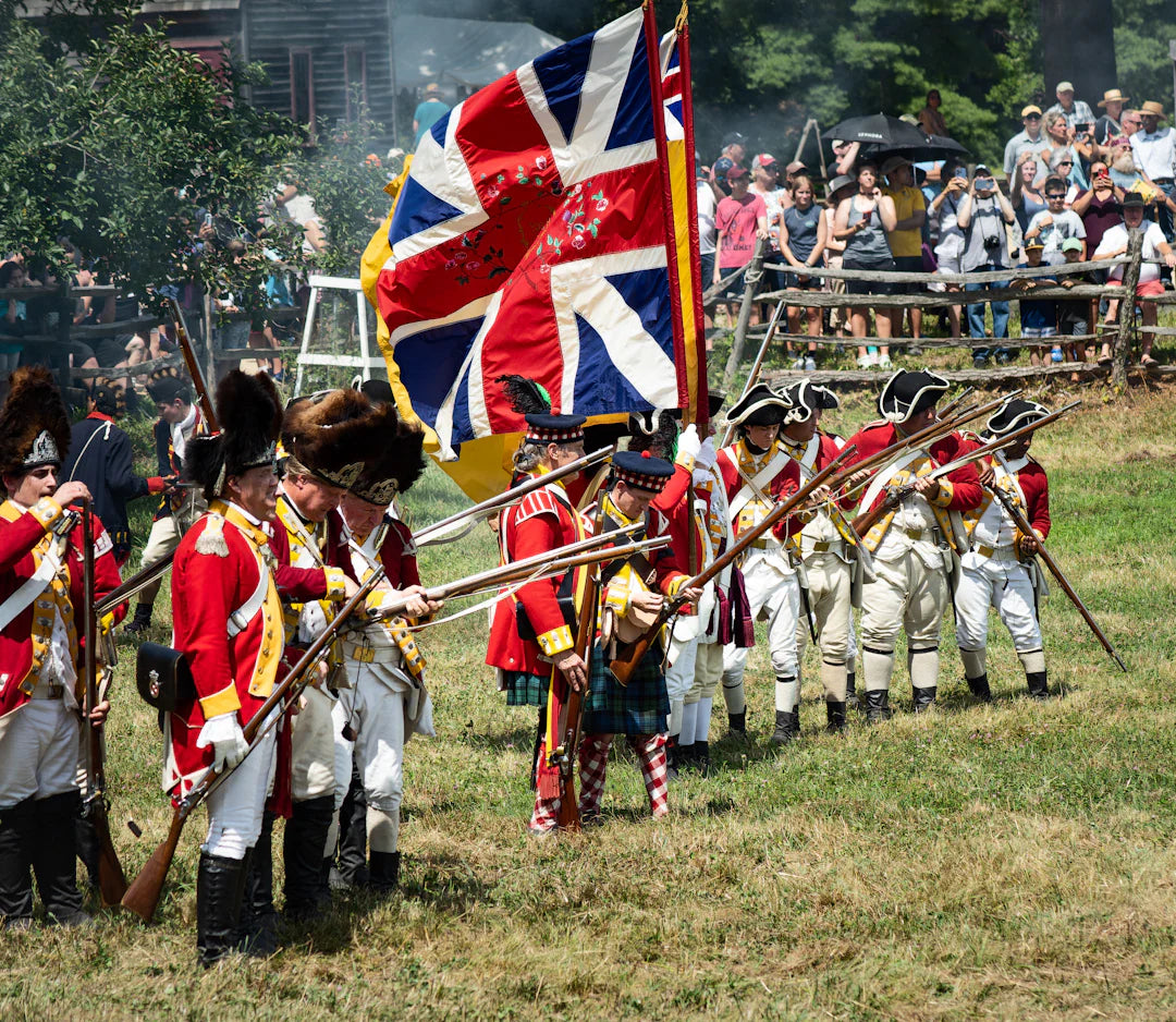 Red and white British flag with gold trim in American Revolution reenactment