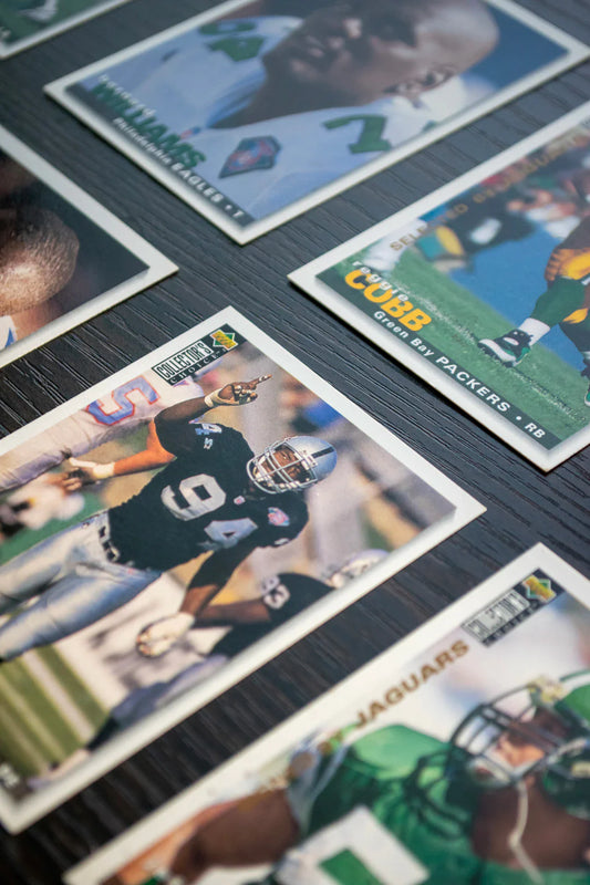 Vintage PSA graded trading cards of Jerry Rice and Brett Favre