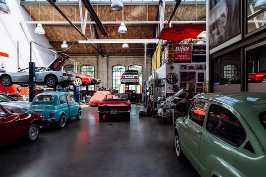 Automobile repair shop with classic cars and vintage Americana in for service