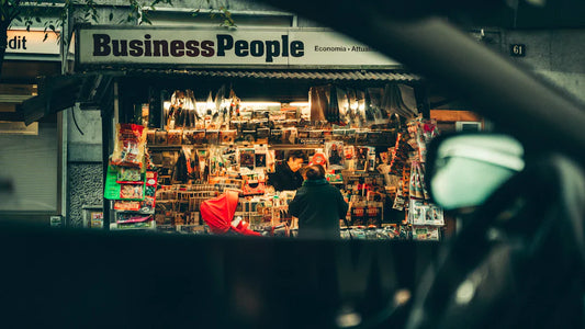 Vibrant newsstand with magazines and goods showcasing small businesses in the industrial era