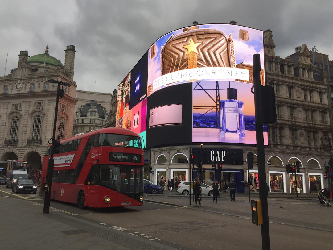 Red double-decker bus showcasing smart billboards with social media integration