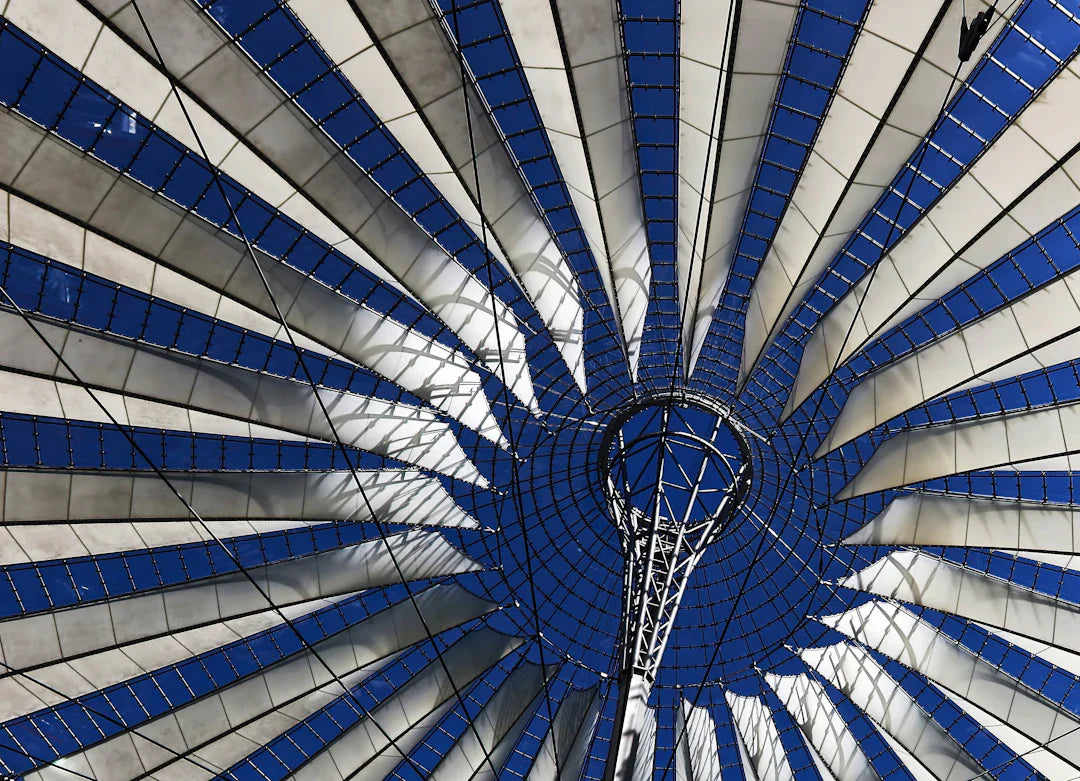Tensile fabric roof with blue and white panels in a reconstruction site related to Freedmen’s Bureau