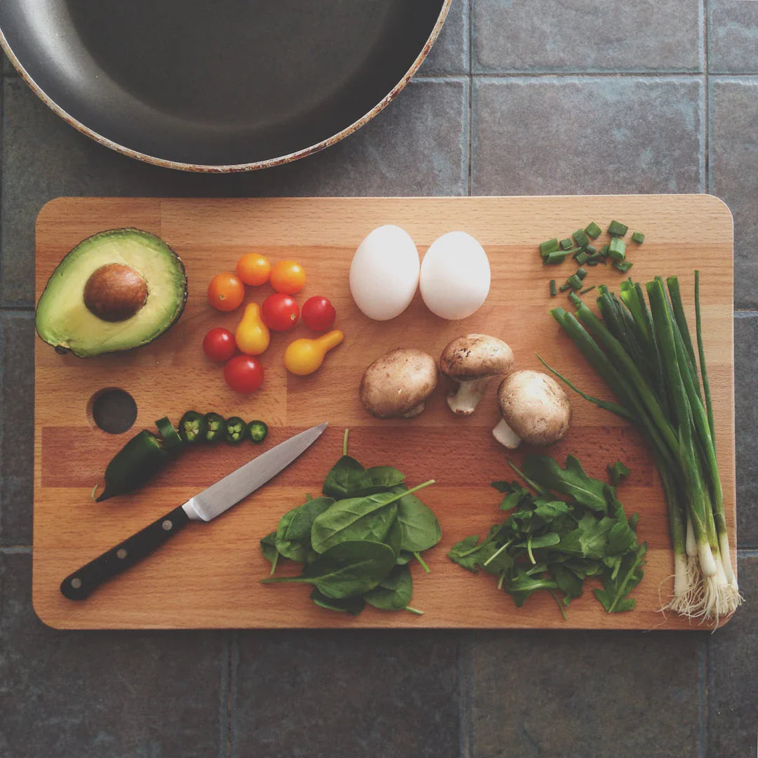 Fresh ingredients for an omelet on a cutting board, perfect for wild west cuisine lovers