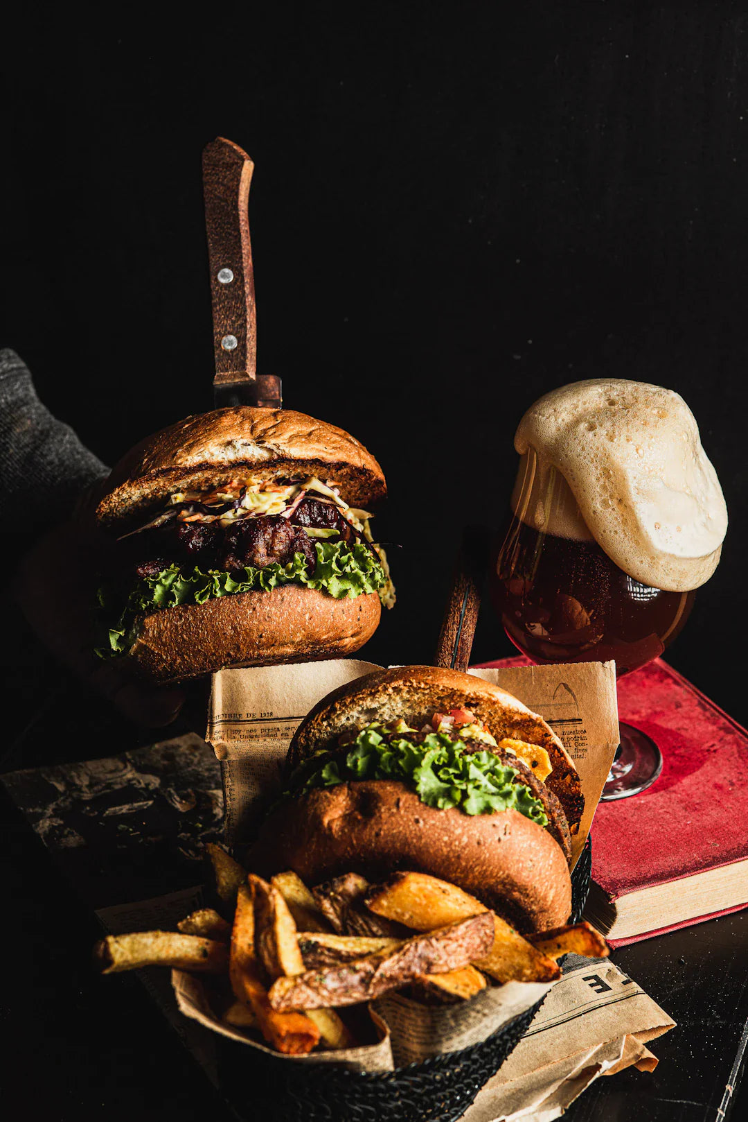 Gourmet burger set with fries in rustic basket, American cuisine classic