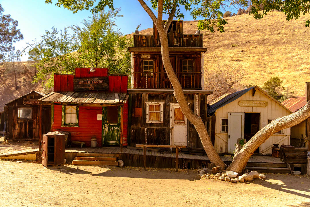 Weathered Gold Rush saloon with Wells Fargo sign and green door