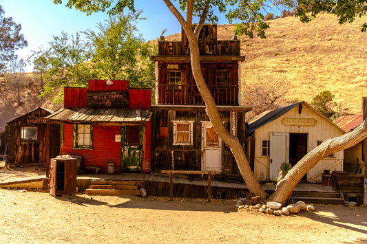Weathered Gold Rush saloon with Wells Fargo sign and green door