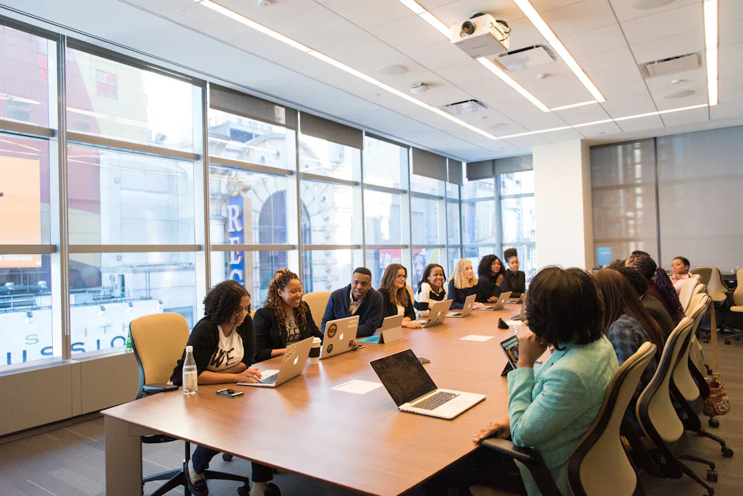 Diverse professionals collaborating in a modern conference room about workforce diversity during the American Revolution