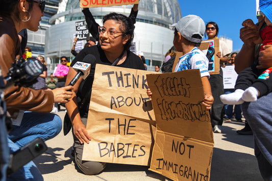 Protest sign in modern American history: think about the babies