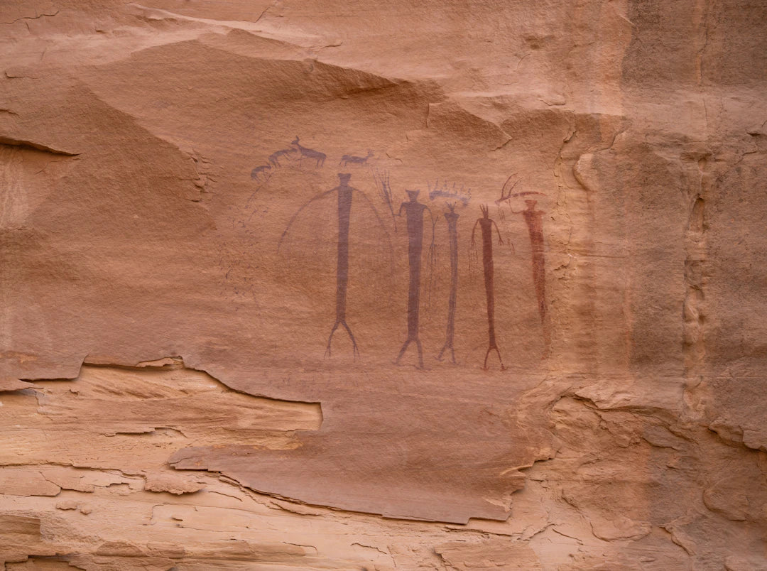 Ancient Native American tribes pictographs on sandstone cliff face in Wild West history
