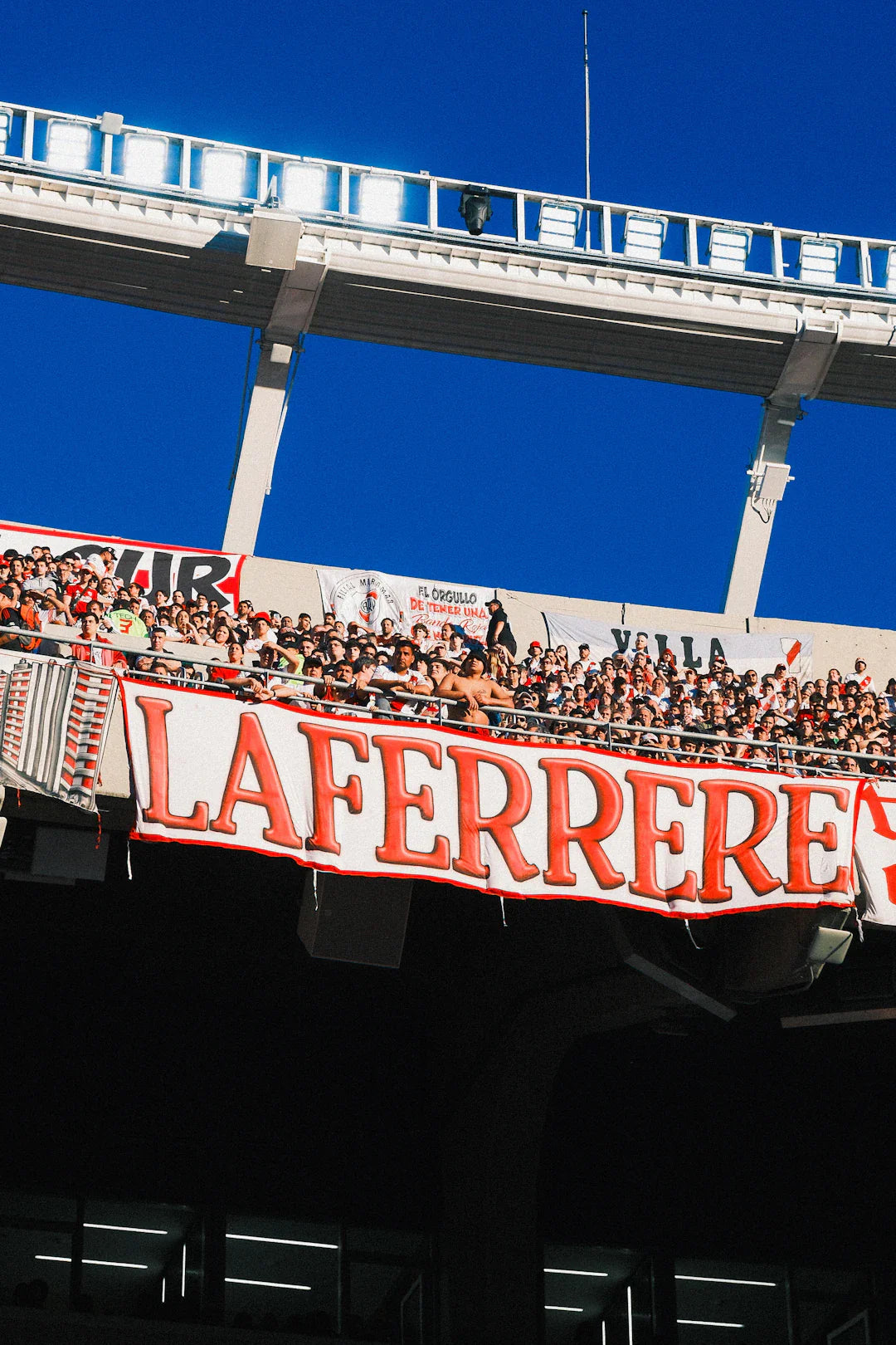 Red and white La Ferrerre banner in American sports identity article