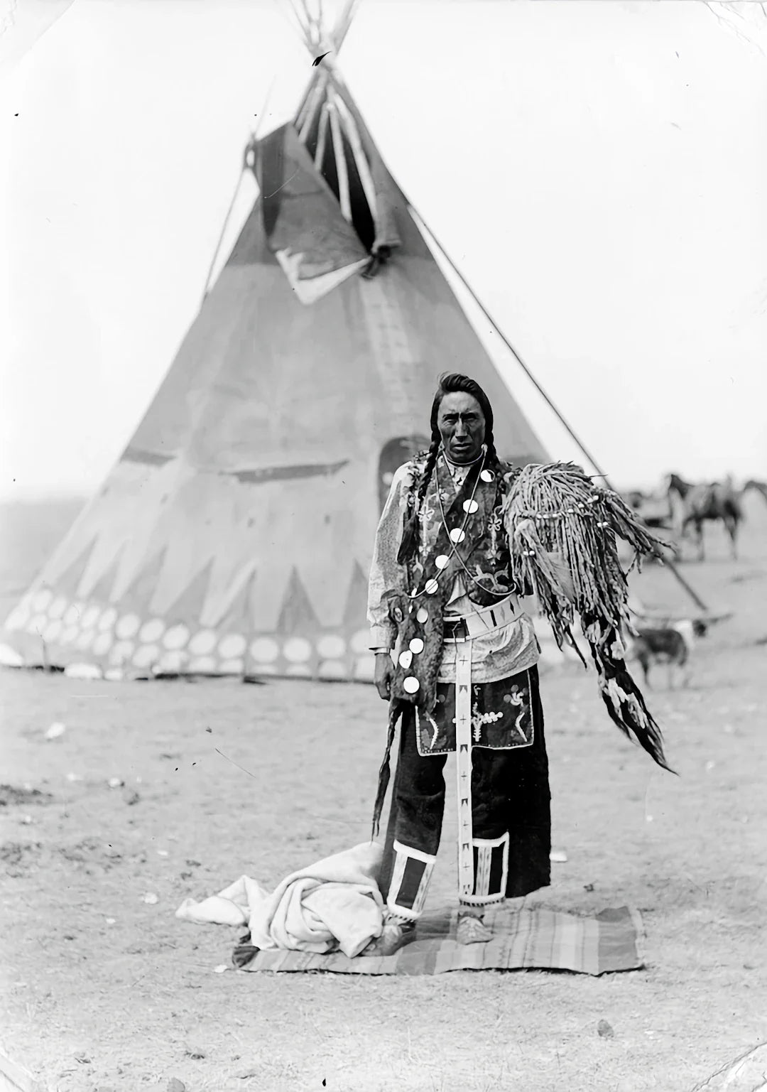 Black and white feathered headdress with intricate beadwork from Native American tribes