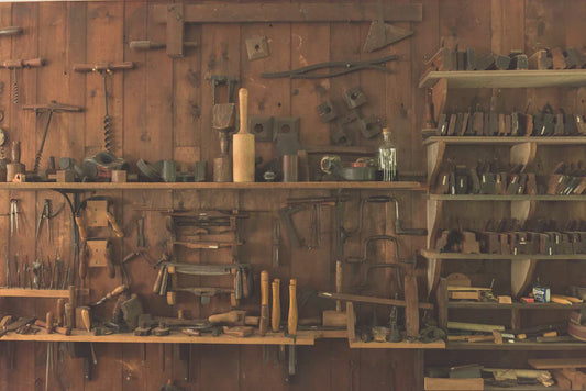 Workshop with hand tools, symbolizing leaders like Frederick Douglass and Thaddeus Stevens during Reconstruction Acts