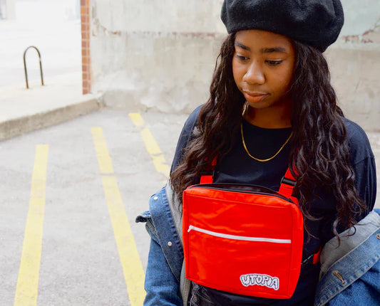 Red chest bag from 90s streetwear style seen in modern fashion and social media now