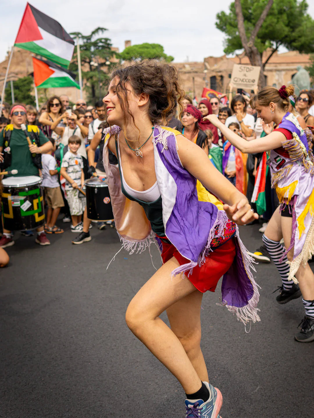 Purple and white fringe vest with red shorts in protest music vibe