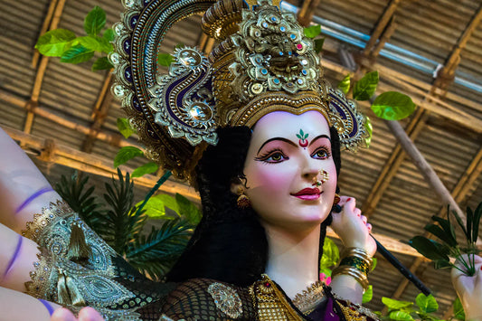 Colorful Hindu goddess idol blending wild west spirit with traditional cowboy cuisine vibe
