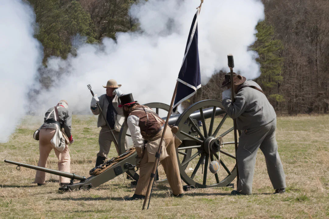 Civil War-era cannon with black gold accents, wooden wheels, brass barrel