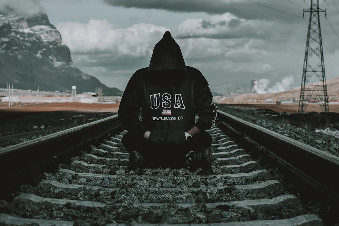 Black hooded sweatshirt with USA Washington DC text showcasing railroad expansion and culture