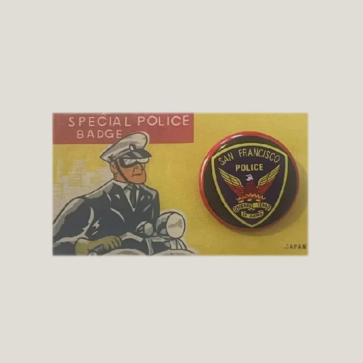 Vintage 1950s San Francisco tin litho special police badge pinned to its original illustrated dime-store card.