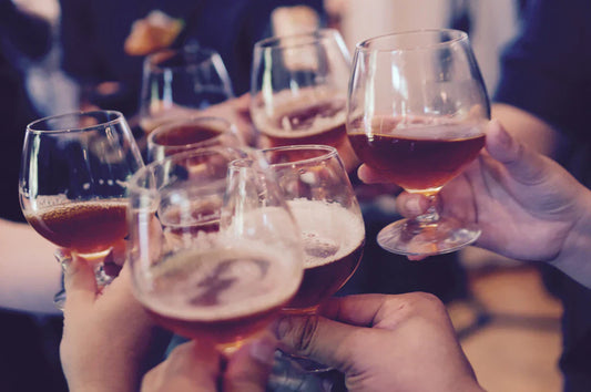 Toasting beer glasses at a modern party celebrating 90s rave culture and rave vibes