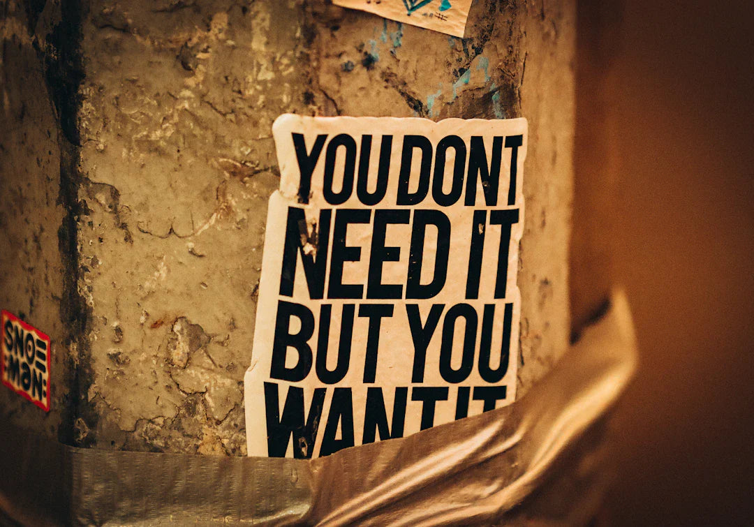 White sticker with bold black text on textured surface in The Rise of Consumer Culture article