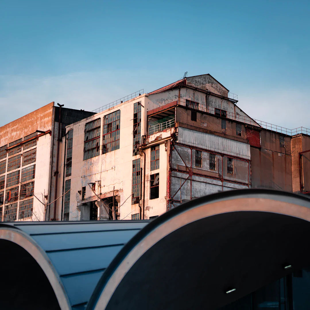 Weathered industrial buildings with broken windows illustrating changing consumer habits