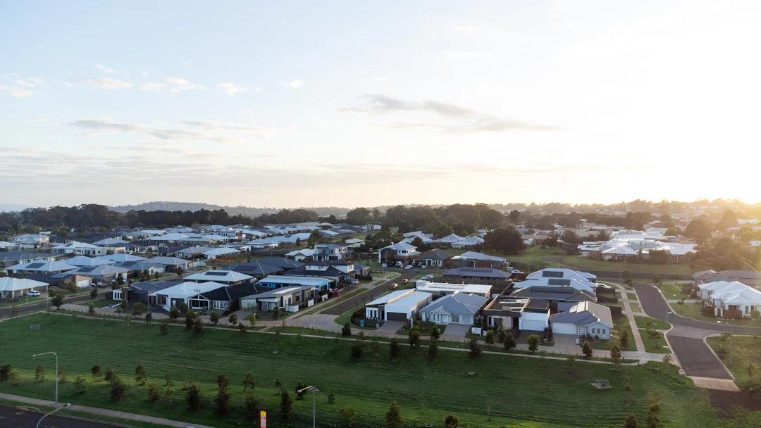 Modern white suburban house with gray roof, evoking post-World War living