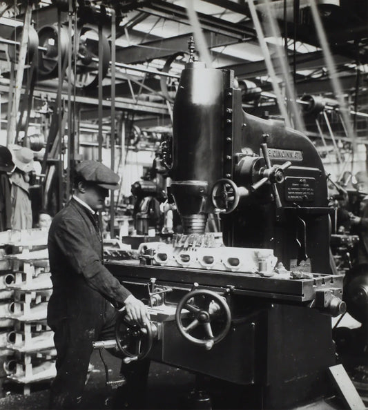 Industrial milling machine with engine parts on worktable showcasing key lessons of the industrial revolution