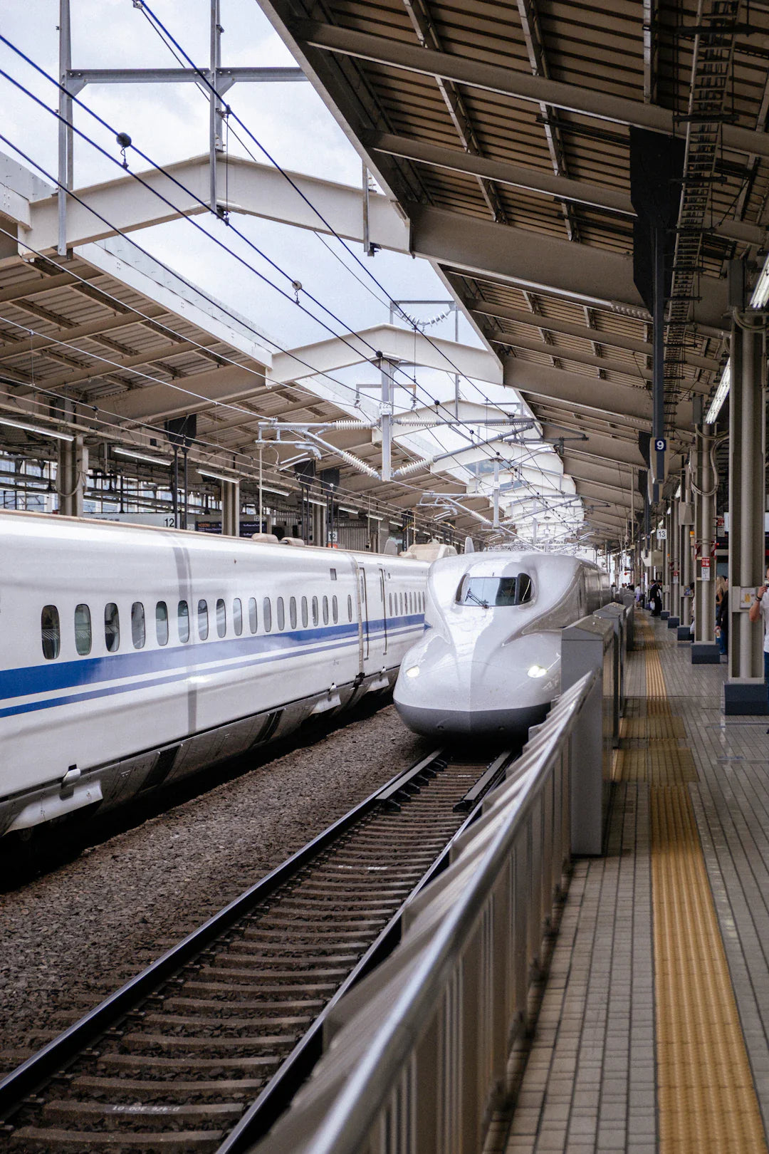 Two bullet trains at station platform amid transportation innovations