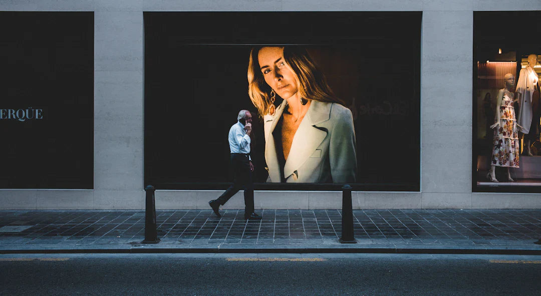 Woman’s face on billboard showing emotional triggers and social proof in ad campaigns