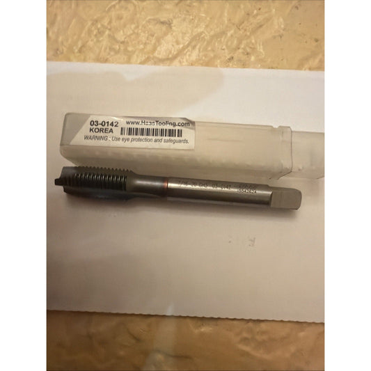 Haas spiral flute tap with white plastic packaging labeled 03-0142 on white paper background, overhead view.