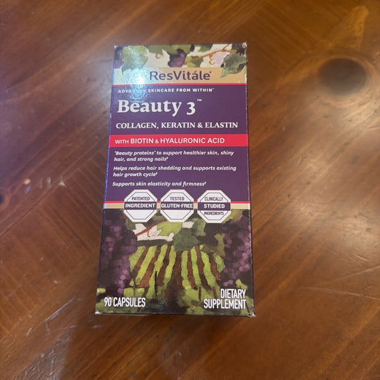 ResVitále Beauty 3 supplement box displaying purple and gold packaging with collagen, keratin, and elastin ingredients on wooden surface.