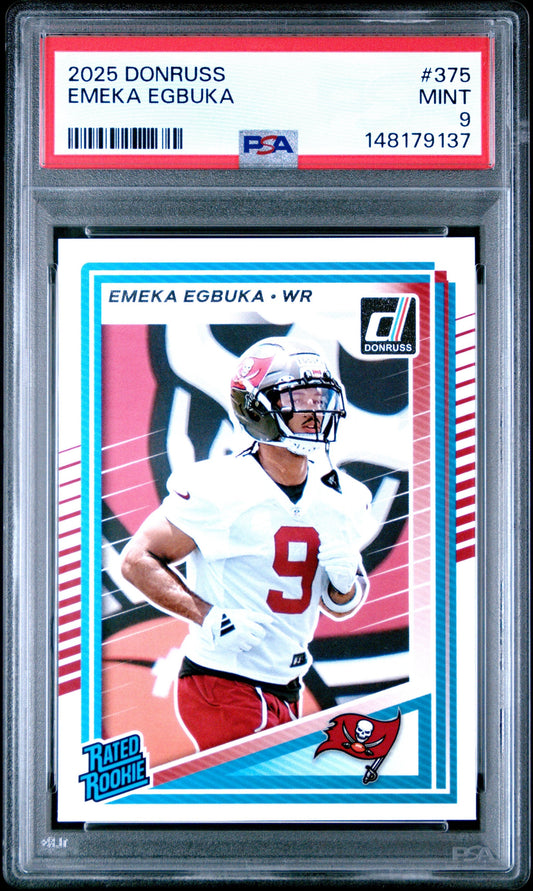 PSA-graded 2025 Donruss Emeka Egbuka rookie card in clear case showing front with player in white Tampa Bay Buccaneers uniform, blue border, red rating label.