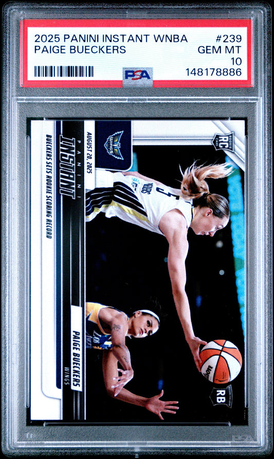 PSA-graded trading card in clear plastic case featuring Paige Bueckers in white uniform during basketball gameplay, with red label strip and certification number visible.