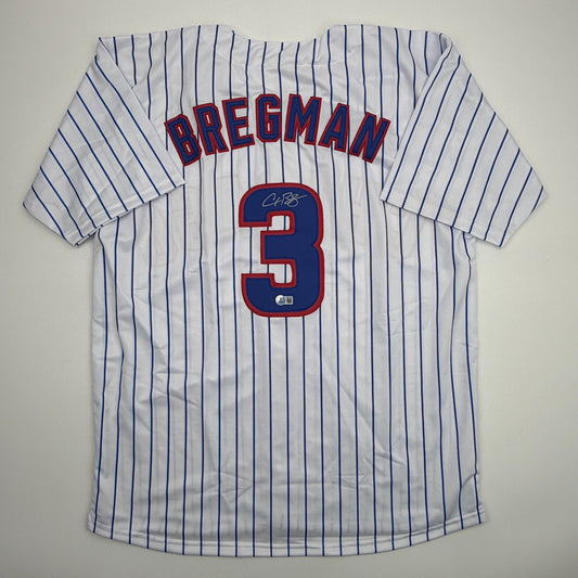 White pinstriped baseball jersey with "BREGMAN" and number 3 displayed on back, featuring autographed signature.