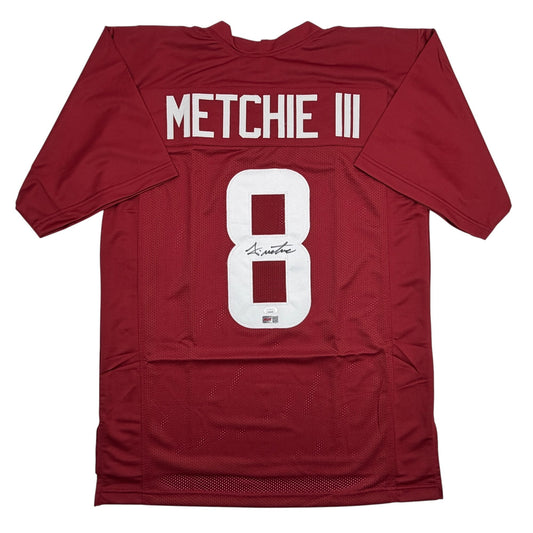 Signed maroon Alabama football jersey number 8 with "METCHIE III" printed across back, displayed flat against white background.