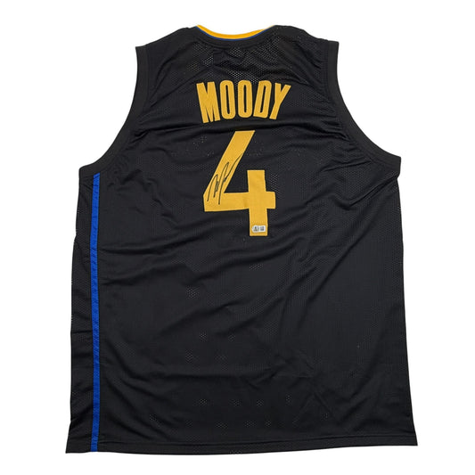 Back view of black mesh basketball jersey with gold "MOODY 4" and blue side stripe, featuring autograph on number.