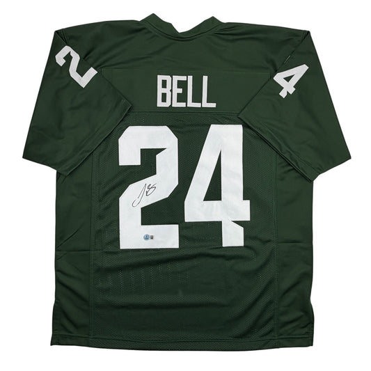 Dark green college football jersey with white number 24, "BELL" nameplate, and autographed signature, displayed flat against white background.