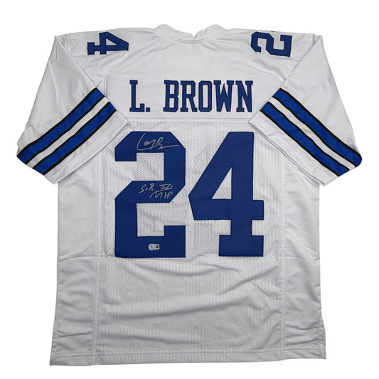 White Dallas Cowboys football jersey #34 with blue "L. BROWN" nameplate and autographed inscriptions, displayed flat front view.