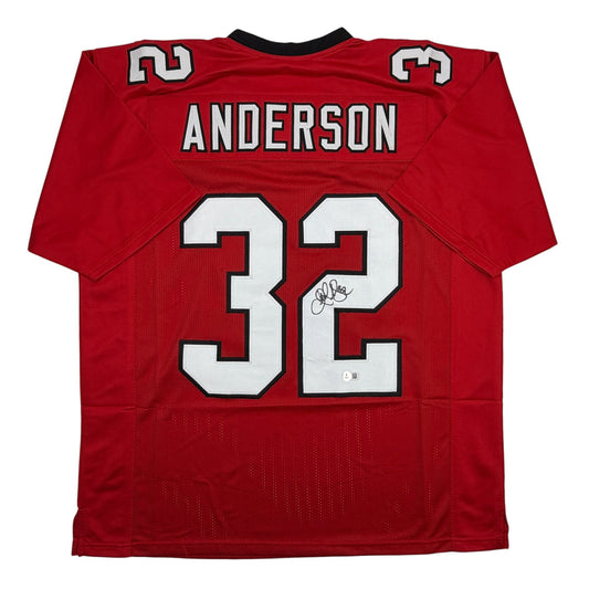 Red Atlanta Falcons football jersey number 32 with "ANDERSON" nameplate and autographed signature, displayed flat against white background.