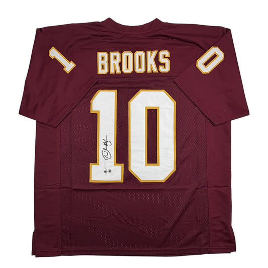 Maroon Florida State football jersey number 10 with "Brooks" nameplate displayed flat, showing autographed white numerals and gold trim.