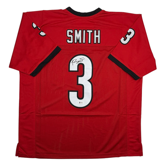 Back view of red college football jersey with "SMITH" and number 3 printed in white and black, featuring autographed number 3 on chest.