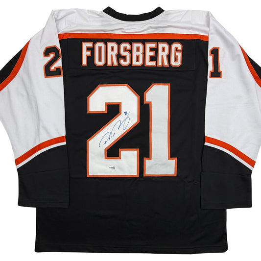 Back view of black Philadelphia hockey jersey with white sleeves, orange and white number 21, "FORSBERG" nameplate, and blue autograph signature on the number.