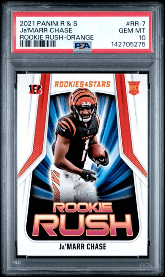 PSA-graded trading card in clear case displaying Ja'Marr Chase in orange Bengal uniform holding football, with "Rookie Rush" text and PSA 10 rating label visible.