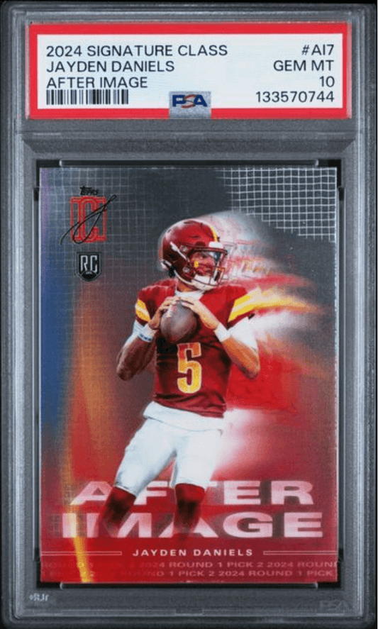 PSA-graded rookie card in clear plastic case showing Jayden Daniels in red Kansas City Chiefs uniform throwing football, with red label and certification details visible.