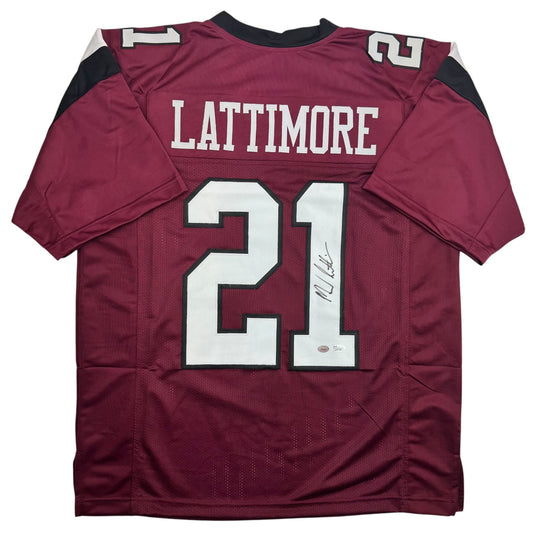 Maroon South Carolina football jersey number 21 with "LATTIMORE" across chest, displayed flat with autographed signature visible on white number.