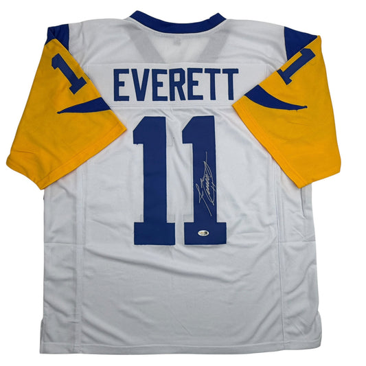Back view of white Los Angeles Rams football jersey number 11 with "EVERETT" nameplate and autograph on blue numerals.