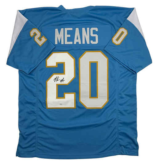 Blue football jersey with "MEANS" and number "20" in white and gold lettering, displayed flat with visible autograph on the number.