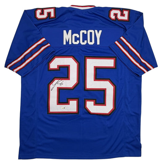 Back view of blue Buffalo Bills jersey number 25 with McCoy nameplate and signature, red and white trim visible.