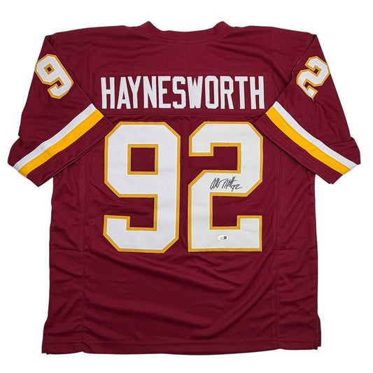 Back view of maroon Haynesworth #92 Washington football jersey with white and gold numerals and shoulder stripes.