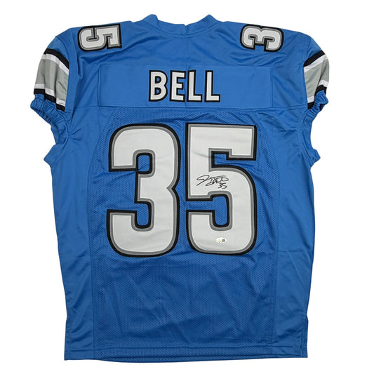 Blue Detroit Lions pro cut football jersey displaying number 35 and "BELL" nameplate, back view with visible autograph.